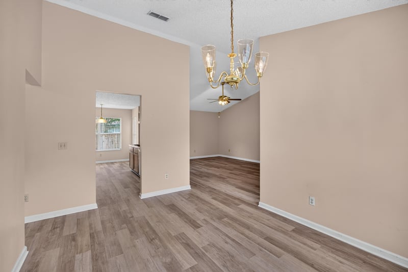 Open living and dining area with chandelier at 6646 Shiloh Creek Dr