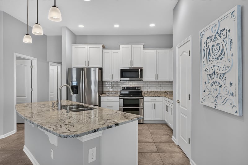 Kitchen with granite counters and double oven at 85 Amia Dr, St. Augustine, FL 32086