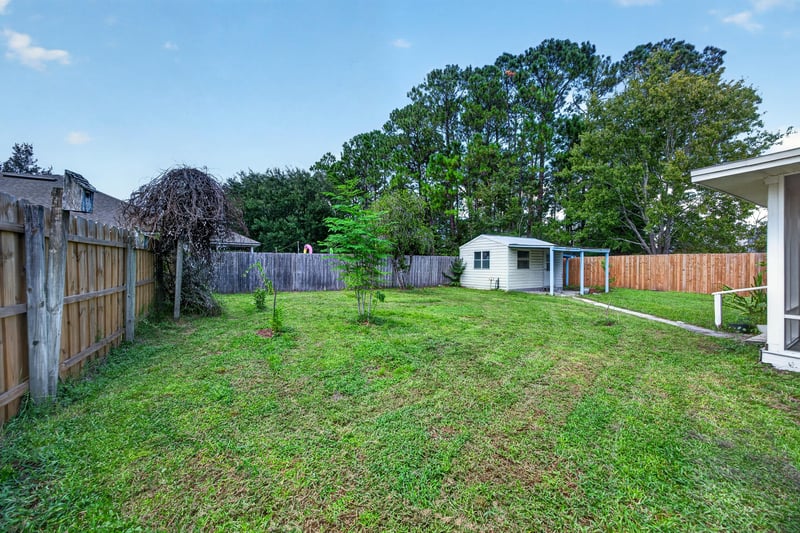 Storage shed and pergola-covered patio at 9691 Nelson Forks Dr, Jacksonville, FL 32222