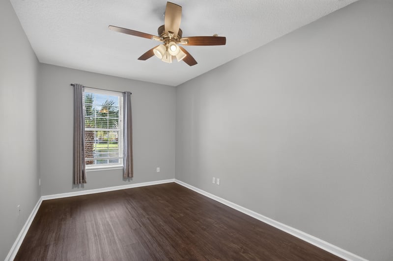 Bedroom with ceiling fan and window at 11251 Campfield Dr unit 4209, Jacksonville, FL 32256