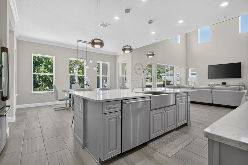 Kitchen island with view into living room at 22 Azura Point