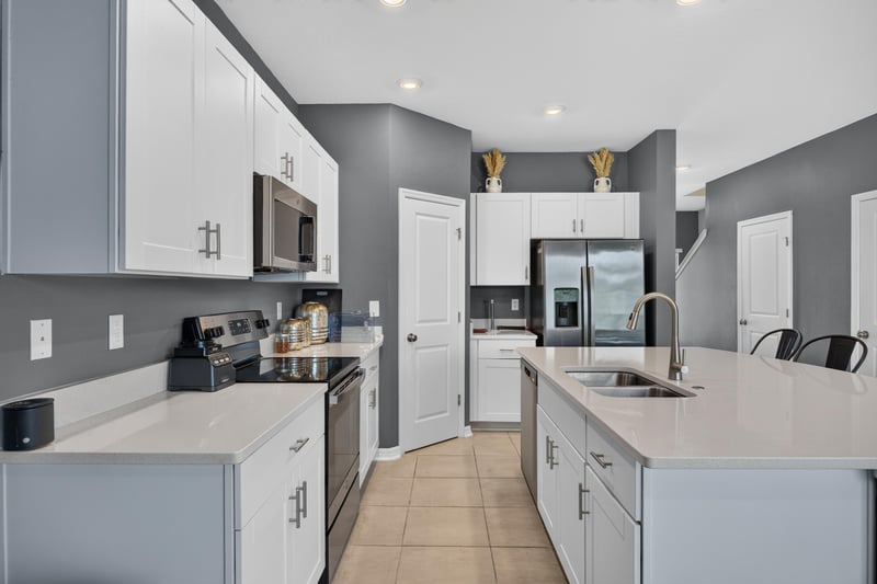 Kitchen counter and cabinets with built-in microwave at 339 Anthony Dr, Jacksonville, FL