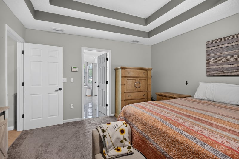 Bedroom doorway with dresser at 2125 Blue Heron Cove Dr, Orange Park, FL 32003
