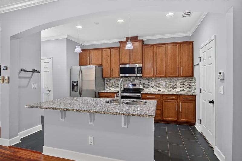 Kitchen with granite island and stainless steel appliances at 6217 Eclipse Cir, Jacksonville, FL 32258
