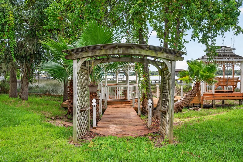 Garden walkway with a wood arbor at 344 Broward Rd, Jacksonville, FL