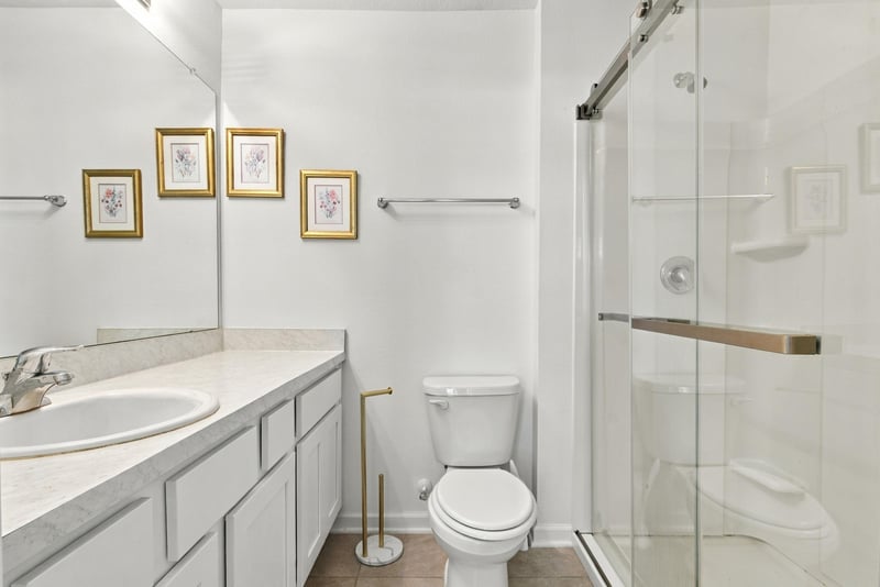 Bathroom with glass shower and vanity at 8359 Zenith Cir, Jacksonville, FL 32256