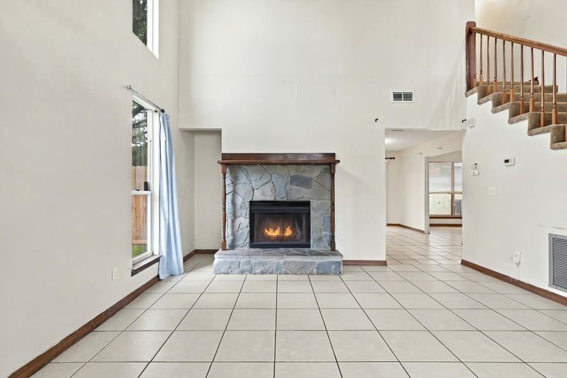 Living room fireplace and open stairway, photographed by Megapixeler on Blue Teal Ct, Jacksonville