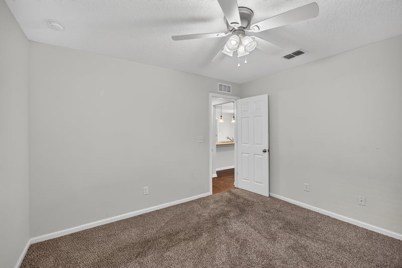 Empty carpeted room at 1002 Ingleside Ave, Jacksonville, FL 32205