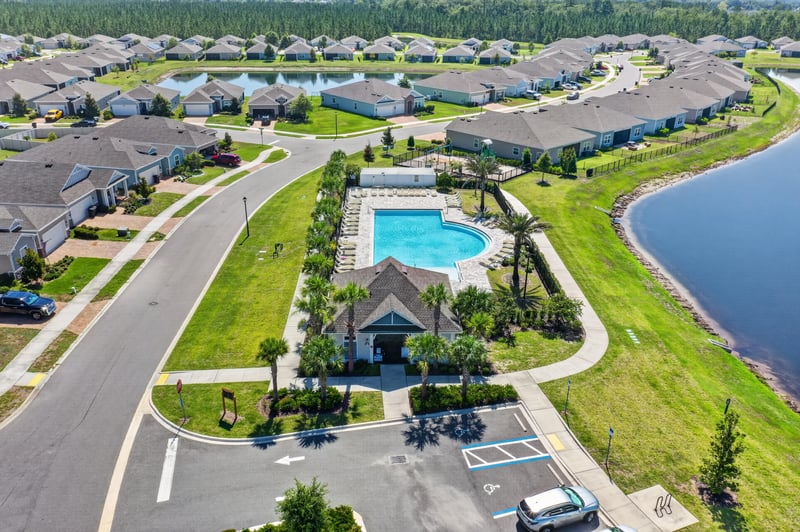 Drone view of community pool and clubhouse in Highland Chase