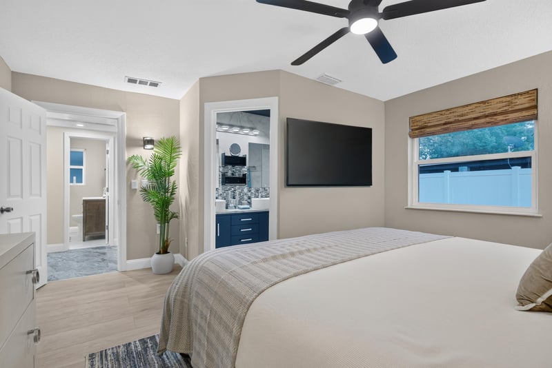 Bedroom with wall-mounted TV at 1525 8th St N, Jacksonville Beach, FL