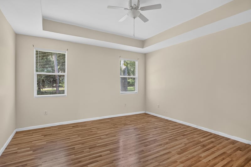 Dining room with tray ceiling and windows at 1012 Fruit Cove Rd, Jacksonville, FL 32259