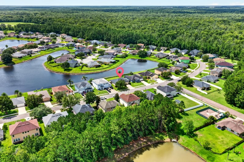 Aerial view of community pond and homes in Middleburg