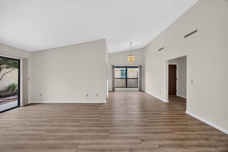 Open living and dining space with vaulted ceiling at 3407 Fairbanks Grant Rd N, Jacksonville, FL 32223