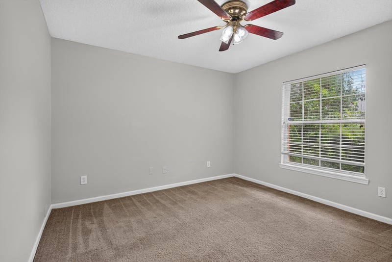 Empty carpeted room with window at 11669 Collins Creek Dr, Jacksonville, FL 32258
