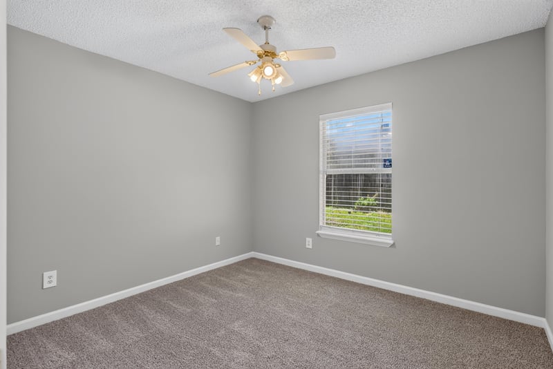 Bedroom with carpet and ceiling fan at 1108 Hidden Cove Cir S, Atlantic Beach, FL 32233