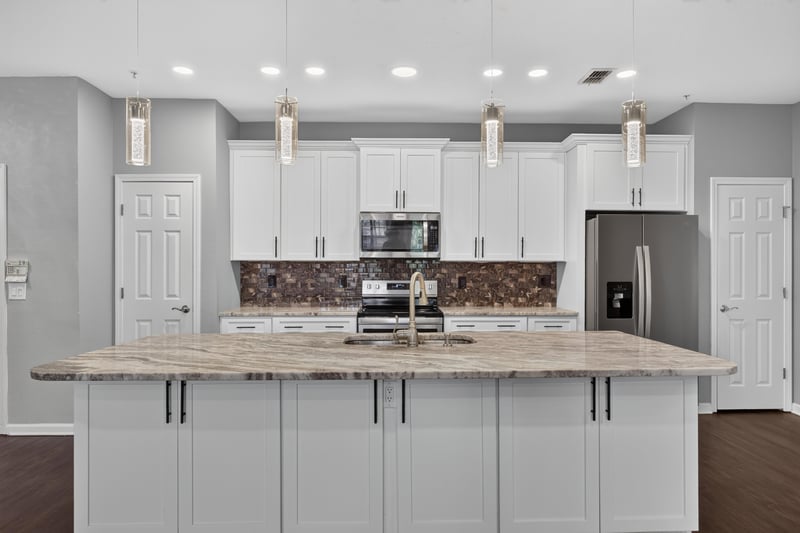Kitchen cabinets and tile backsplash at 11251 Campfield Dr unit 4209, Jacksonville, FL 32256