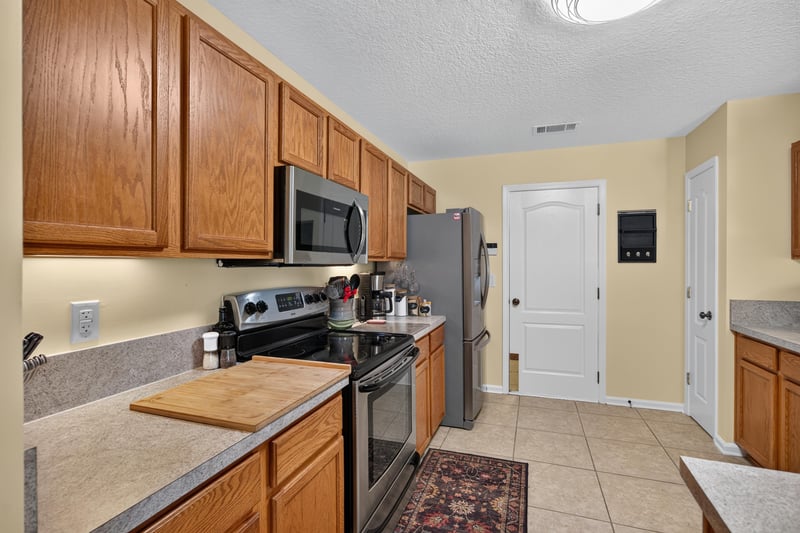 Kitchen counter and stainless range at 1589 Backwater Drive, Middleburg, FL 32068