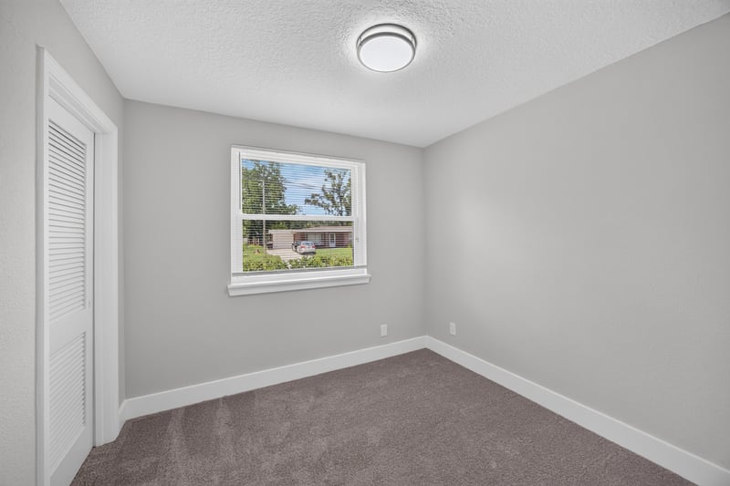 Bedroom with carpet and window at 6238 Randia Dr, Jacksonville, FL 32210