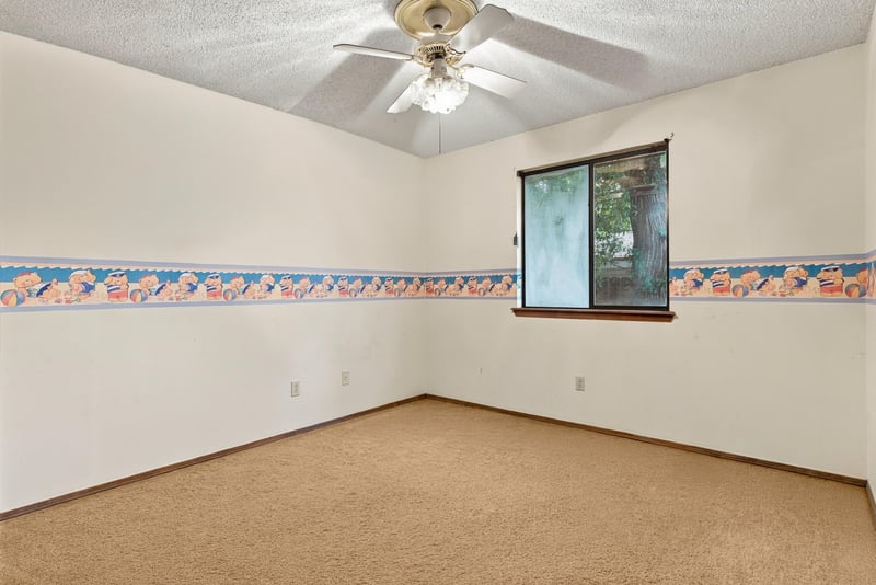 Bedroom with carpet and decorative wall border at 2915 Trenton Ct, Orange Park, FL