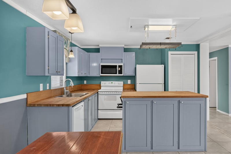 Kitchen view with pendant lighting and drop-leaf table at 2549 Snapdragon Ave, Middleburg, FL 32068