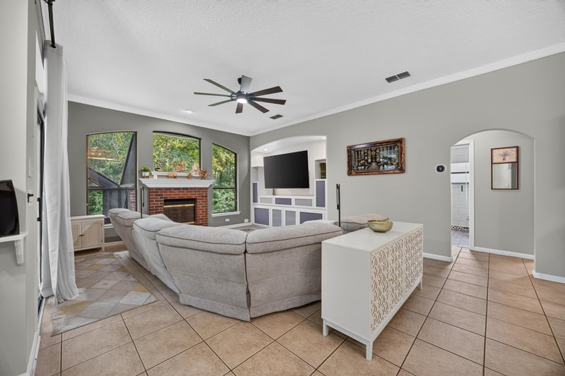 Living room with fireplace and tile floor at 2125 Blue Heron Cove Dr, Orange Park, FL 32003
