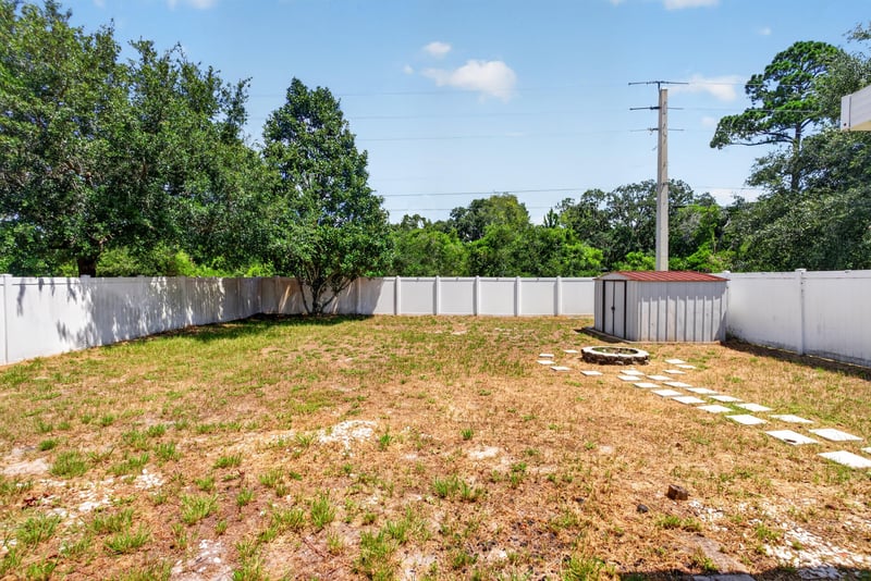 Backyard with wood fence at 224 Pine Arbor Cir, St. Augustine, FL 32084
