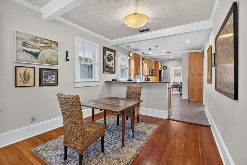 Dining area with wicker chairs opening to the kitchen at 1555 Belmonte Ave, Jacksonville, FL 32207