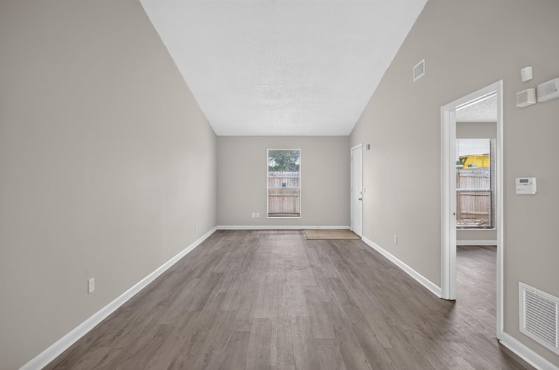 Living space with window and view into hallway at 2717 Trollie Ln, Jacksonville, FL