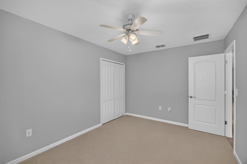 Empty carpeted room with closet at 85 Amia Dr, St. Augustine, FL 32086