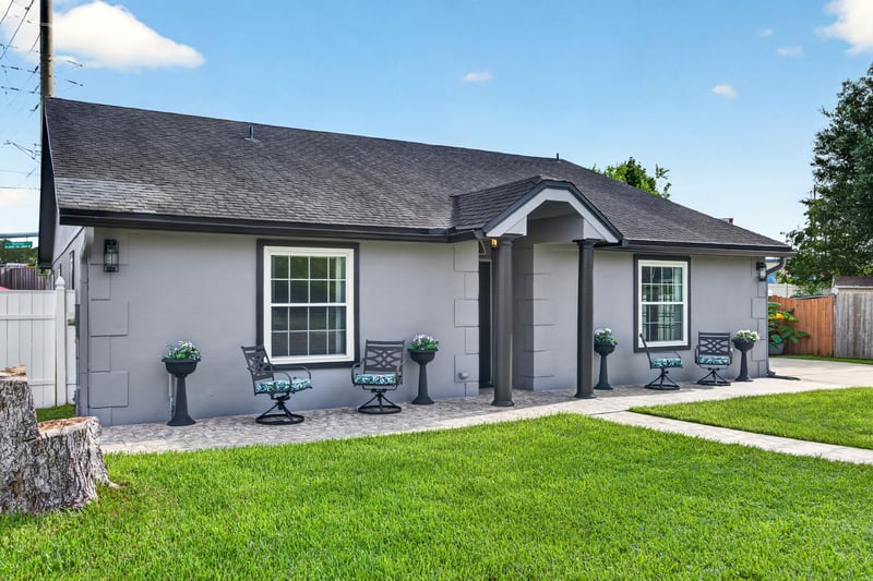 Front exterior with walkway and landscaping at 6931 Cane Grass Ln E, Jacksonville, FL 32244