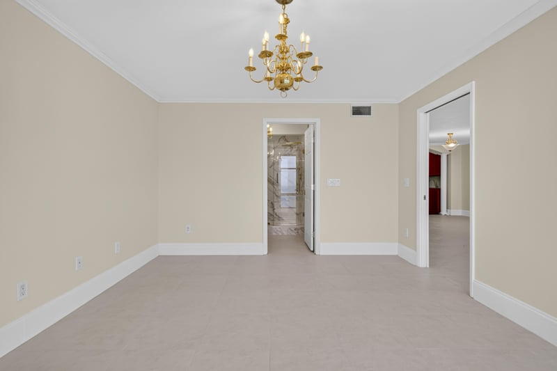 Hallway with chandelier and doors at 1301 1st St S