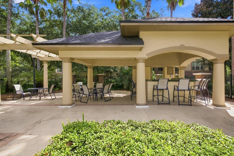 Covered outdoor patio seating area in Reserve at Point Meadows