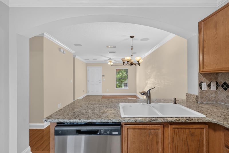 Kitchen sink area with stainless dishwasher at 353 Redwood Ln