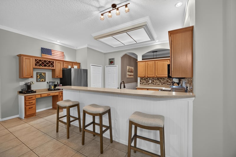 Kitchen with breakfast bar and barstools at 2125 Blue Heron Cove Dr, Orange Park, FL 32003