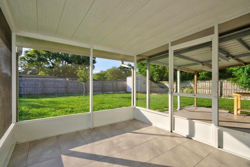 Screened porch interior with tile flooring at 442 Ameca Ave, Orange Park, FL 32073
