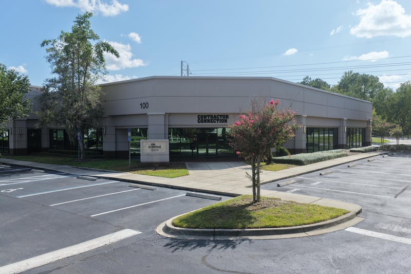 Office building front with landscaped entrance at 10550 Deerwood Park Blvd, Jacksonville, FL 32256