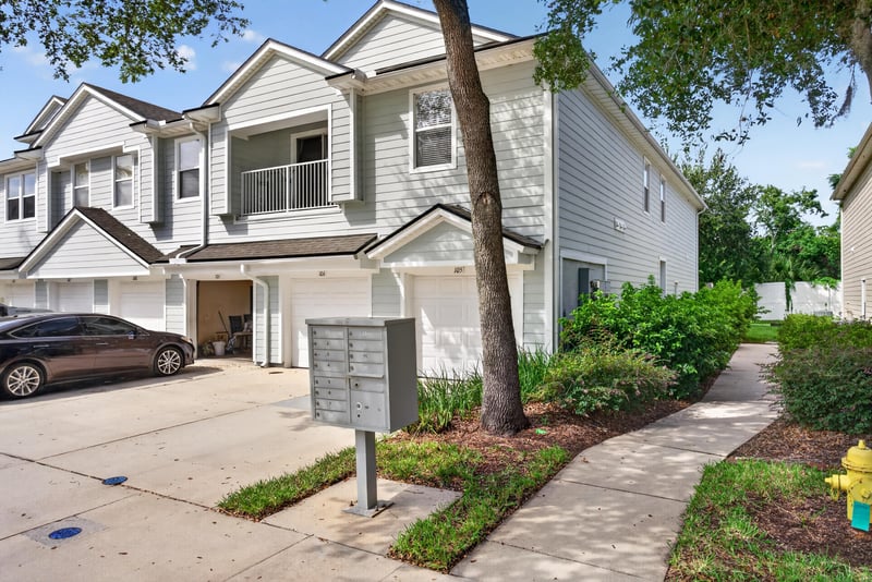 Front view of townhome row from the street at 7047 Deer Lodge Cir, Jacksonville