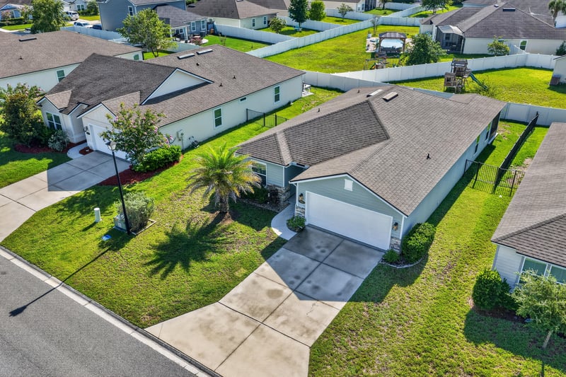 Aerial view of home and surrounding street at 589 Seville Pkwy, St. Augustine, FL