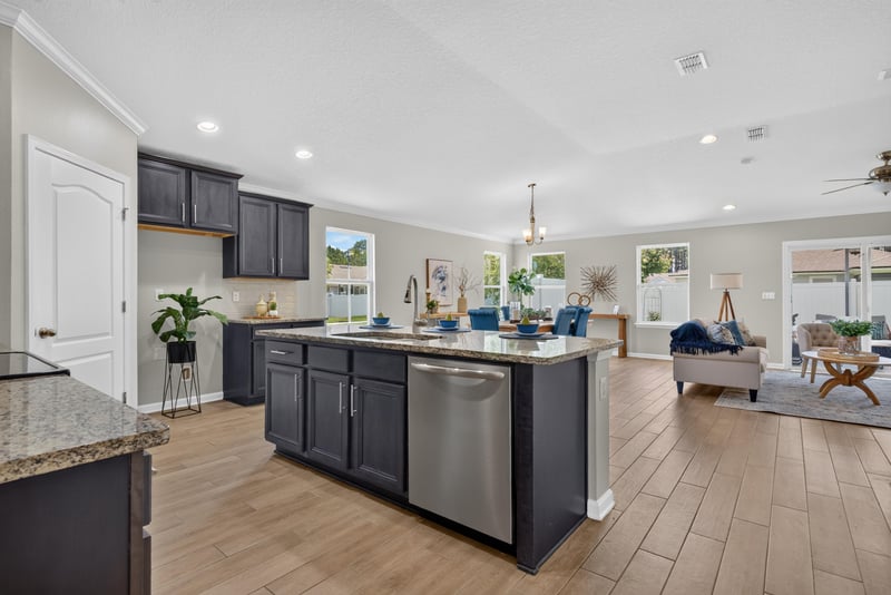 Kitchen open to the dining and living areas at 10066 Andean Fox Dr, Jacksonville, FL 32222