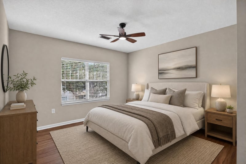 Staged primary bedroom with bed and ceiling fan at 3750 Silver Bluff Blvd, Orange Park, FL