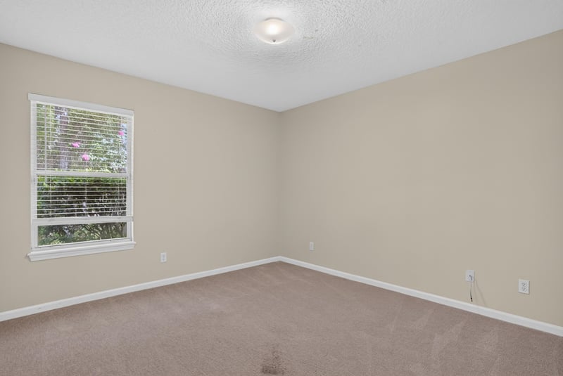 Bedroom with carpet and natural light at 299 John's Creek Pkwy, St. Augustine, FL 32092