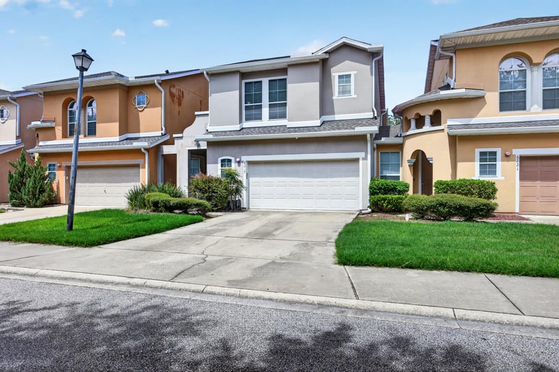 Front exterior view from the street with attached garage at 6217 Eclipse Cir, Jacksonville, FL 32258