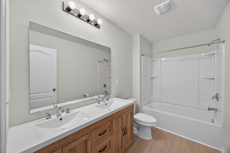 Bathroom with vanity and tub-shower combo at 6830 Hanford St, Jacksonville, FL 32219