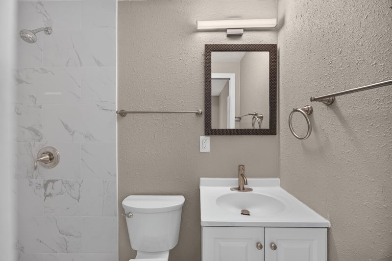 Bathroom with tub-shower and white vanity at 184 Draco St, Orange Park, FL 32073