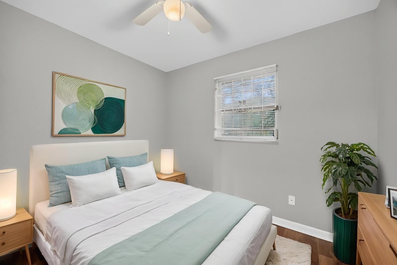 Virtually staged bedroom with bed and dresser at 4030 Leonard Cir W, Jacksonville, FL 32209