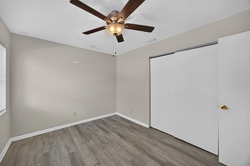 Bedroom with ceiling fan and closet doors at 2658 Trollie Ln apt 1, Jacksonville, FL 32211