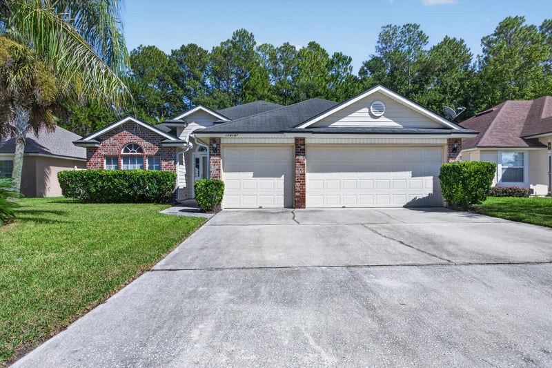 Front exterior, closer view of driveway at 14147 Fish Eagle Dr E, Jacksonville, FL 32226