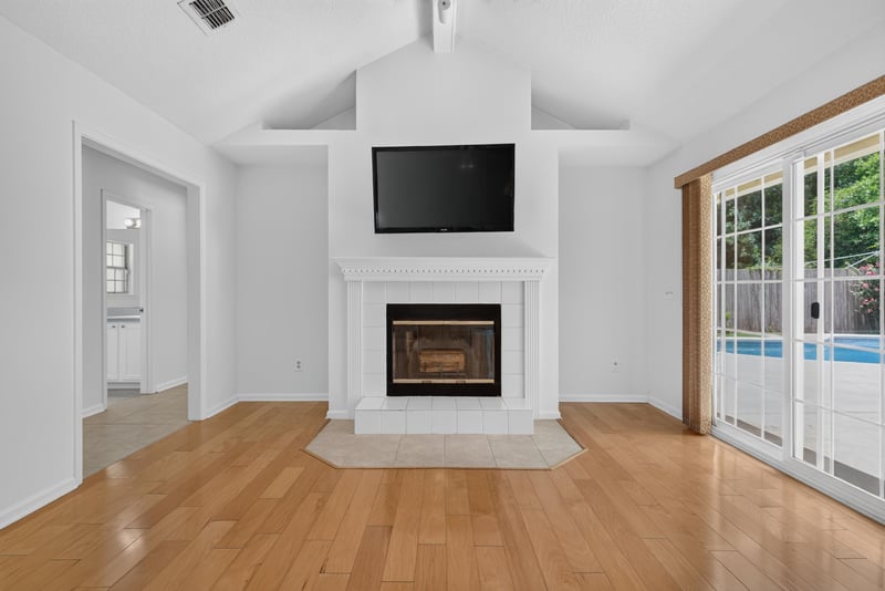 Family room with fireplace and TV niche at 12810 Swamp Owl Ln