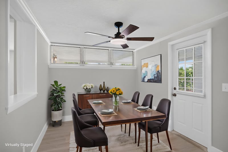 Dining area with staged table and back door at 6238 Randia Dr, Jacksonville, FL 32210