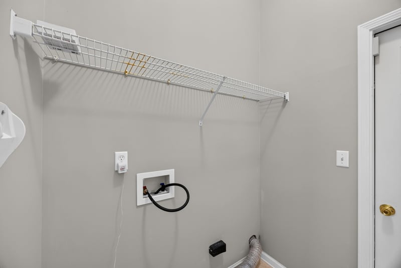 Laundry nook with wire shelving at 9256 Dale View Ln W, Jacksonville, FL 32225